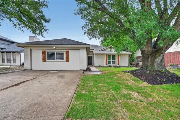 front view of a house with a yard