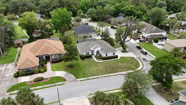 an aerial view of a house with yard swimming pool and outdoor seating