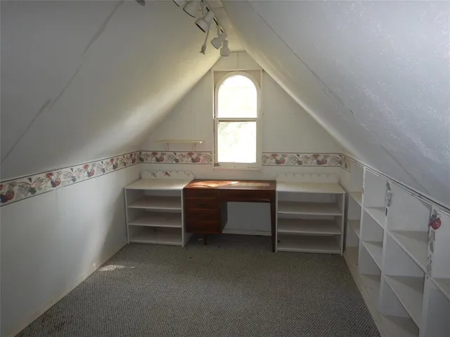 a view of room with cabinets and stairs