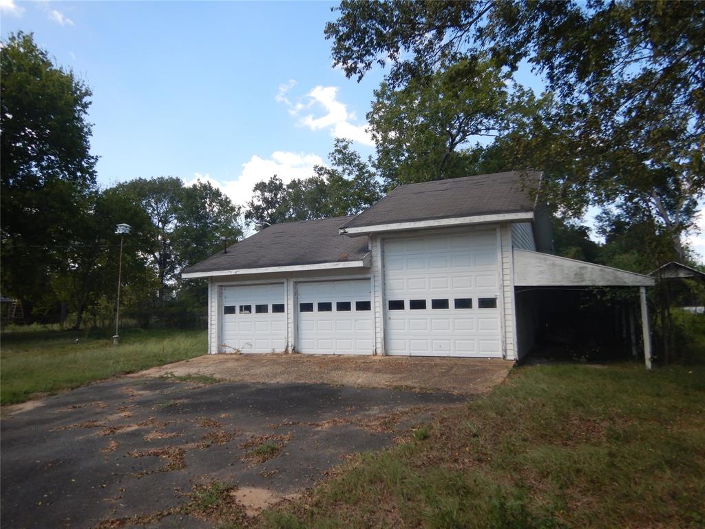 533 Holly Street Grand Cane, LA 71032 - Photo 14 of 15 a front view of a house with a yard and garage