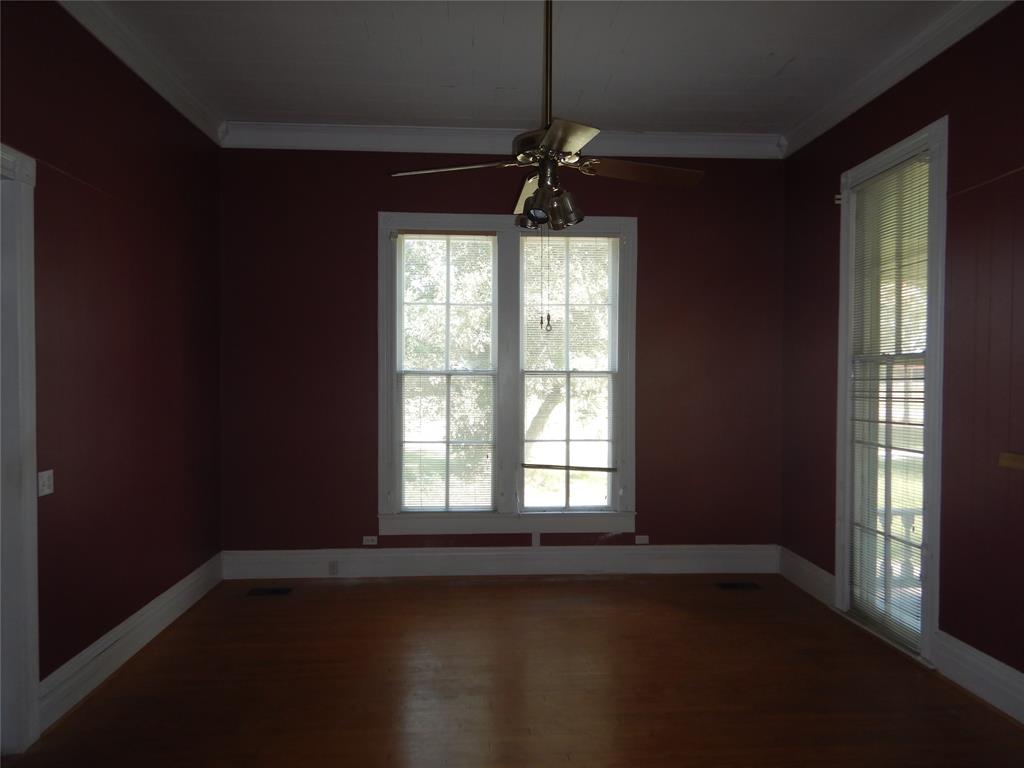 533 Holly Street Grand Cane, LA 71032 - Photo 4 of 15 a view of an empty room with wooden floor and a window