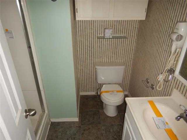 a bathroom with a toilet and a sink