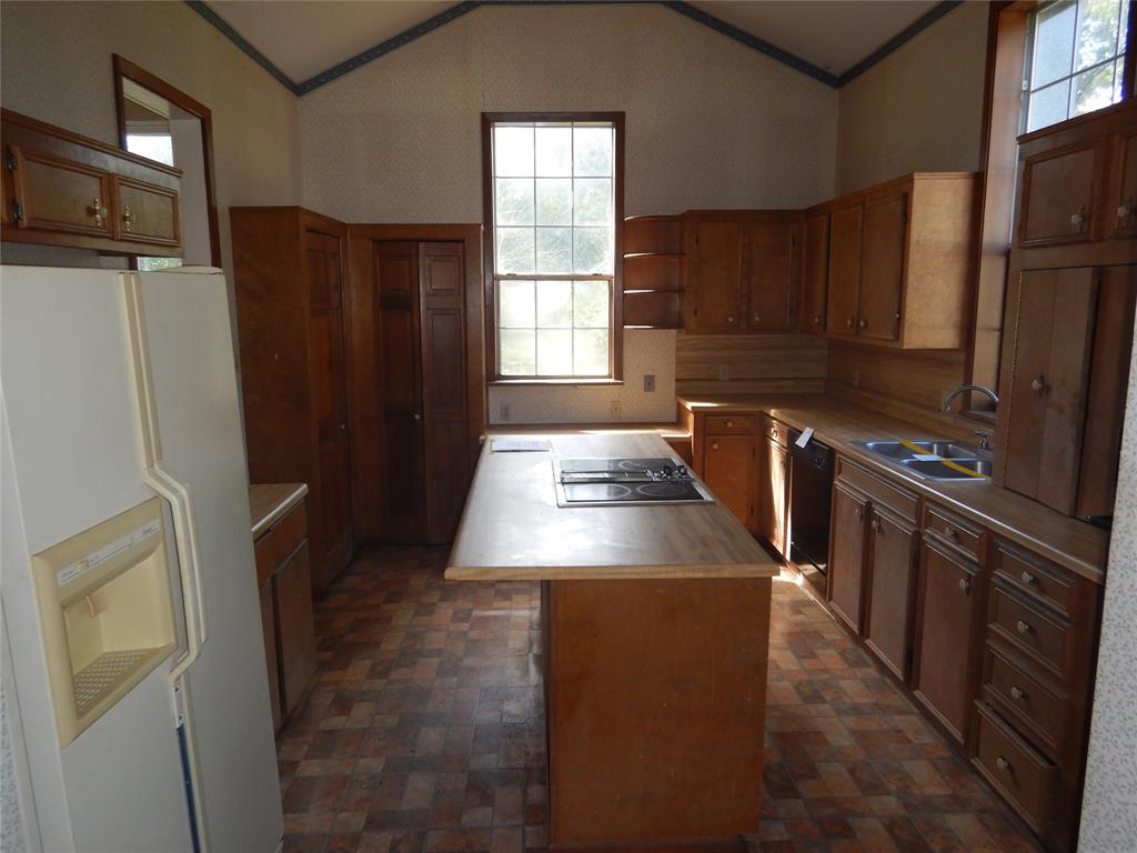 533 Holly Street Grand Cane, LA 71032 - Photo 8 of 15 a kitchen with stainless steel appliances a refrigerator and a stove