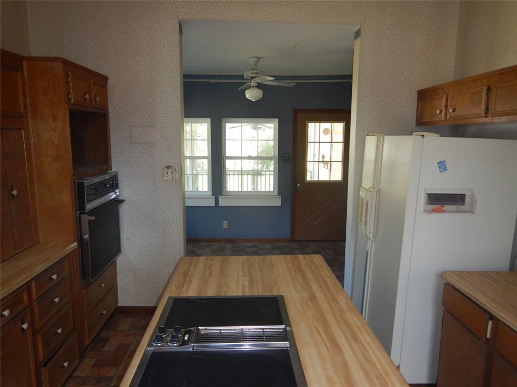 533 Holly Street Grand Cane, LA 71032 - Photo 9 of 15 a view of a livingroom with wooden floor and a kitchen space