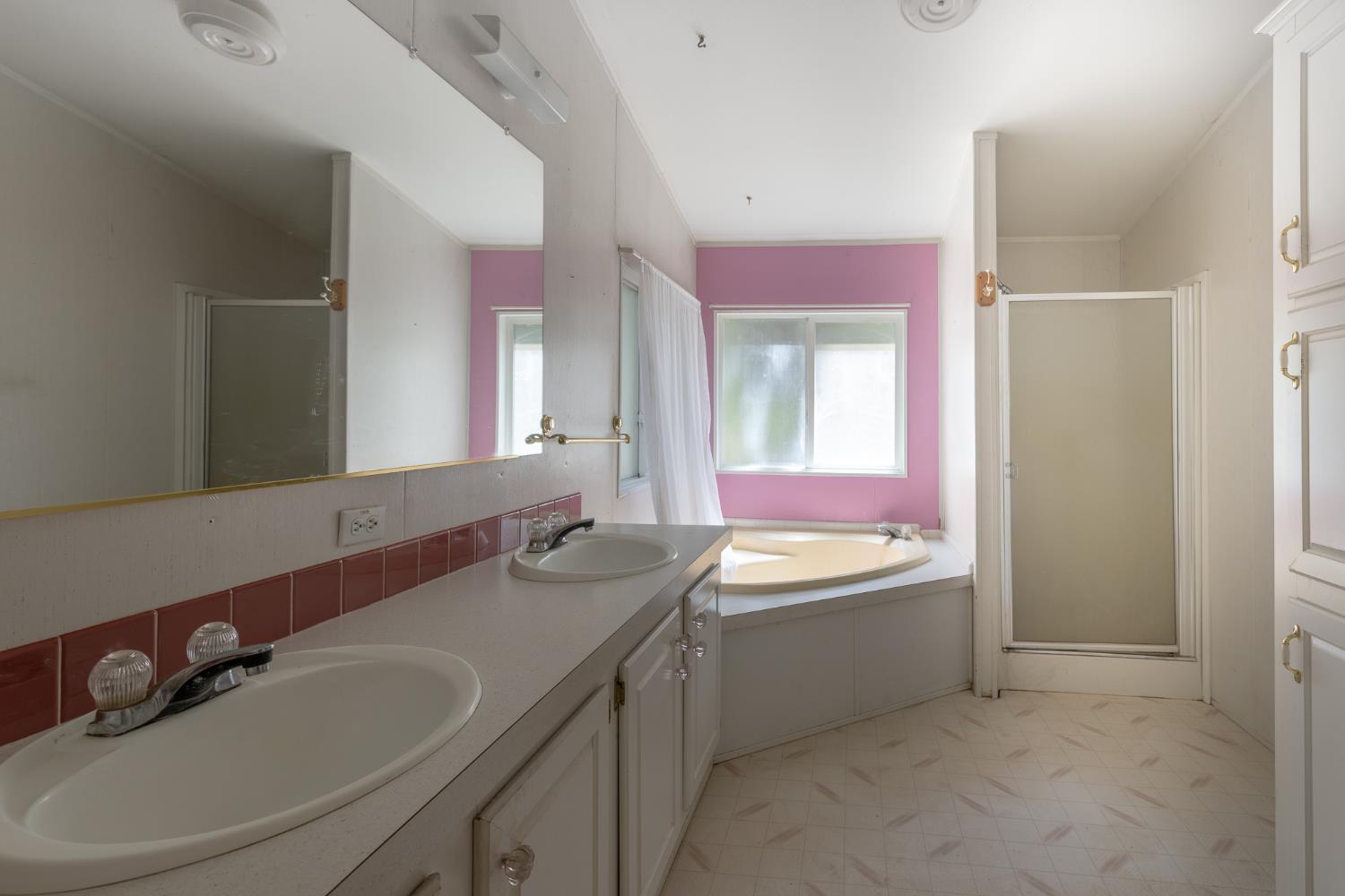 7140 Darling Cabin Road Garden Valley, CA 95633 - Photo 20 of 34 a bathroom with a double vanity sink and a mirror