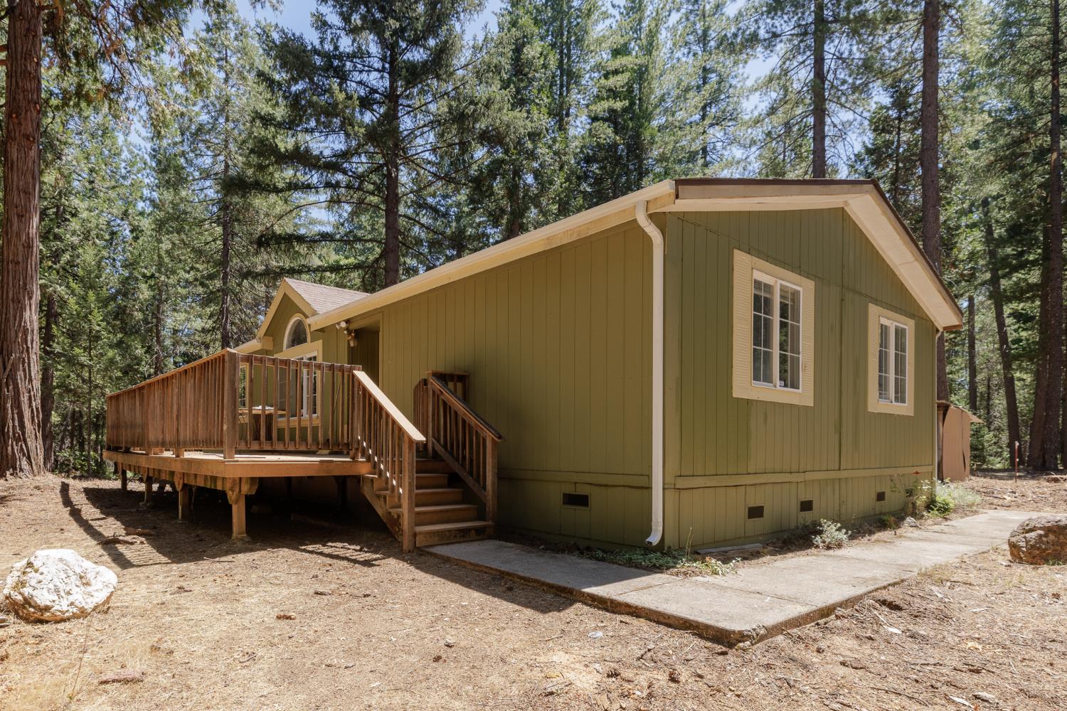 7140 Darling Cabin Road Garden Valley, CA 95633 - Photo 2 of 34 a view of a small house in the snow