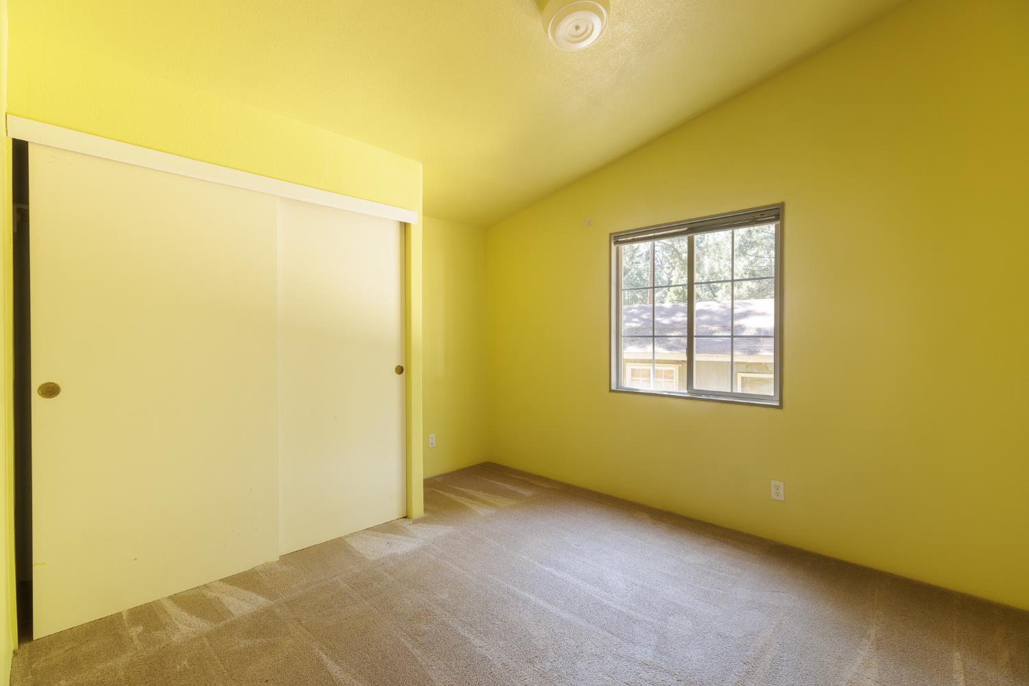 7140 Darling Cabin Road Garden Valley, CA 95633 - Photo 24 of 34 an empty room with windows