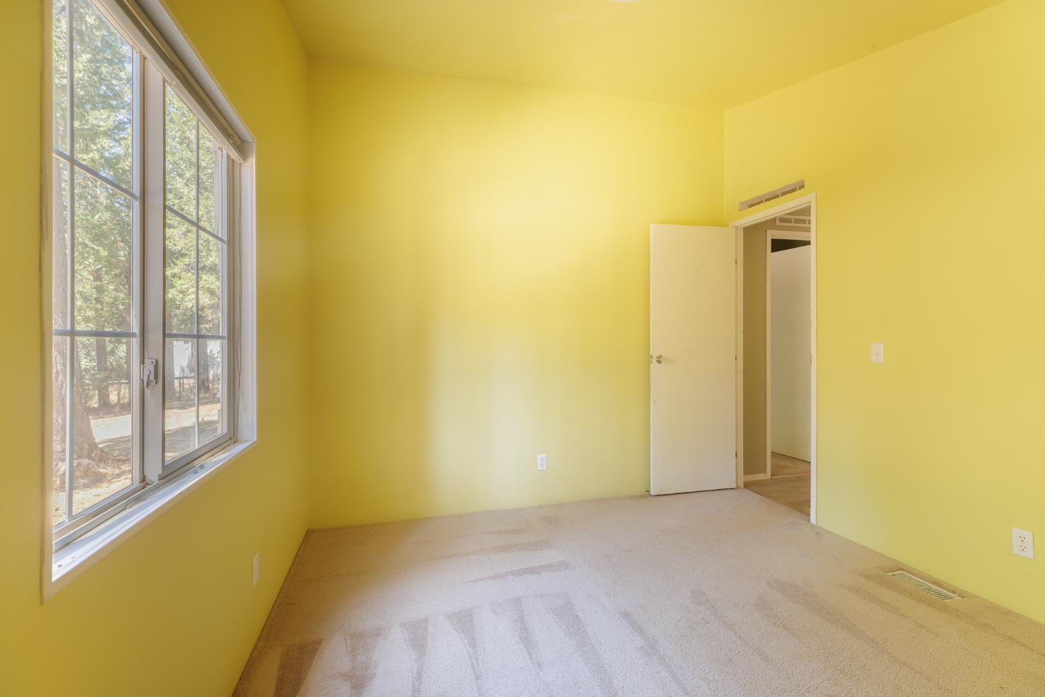 7140 Darling Cabin Road Garden Valley, CA 95633 - Photo 25 of 34 a view of a room with a large window