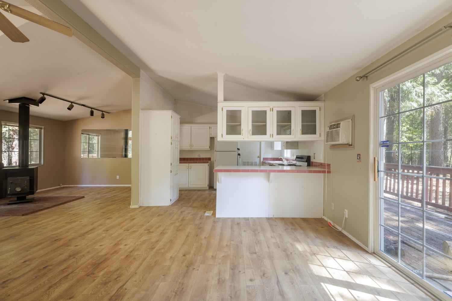 7140 Darling Cabin Road Garden Valley, CA 95633 - Photo 28 of 34 a view of kitchen with wooden floor and a window