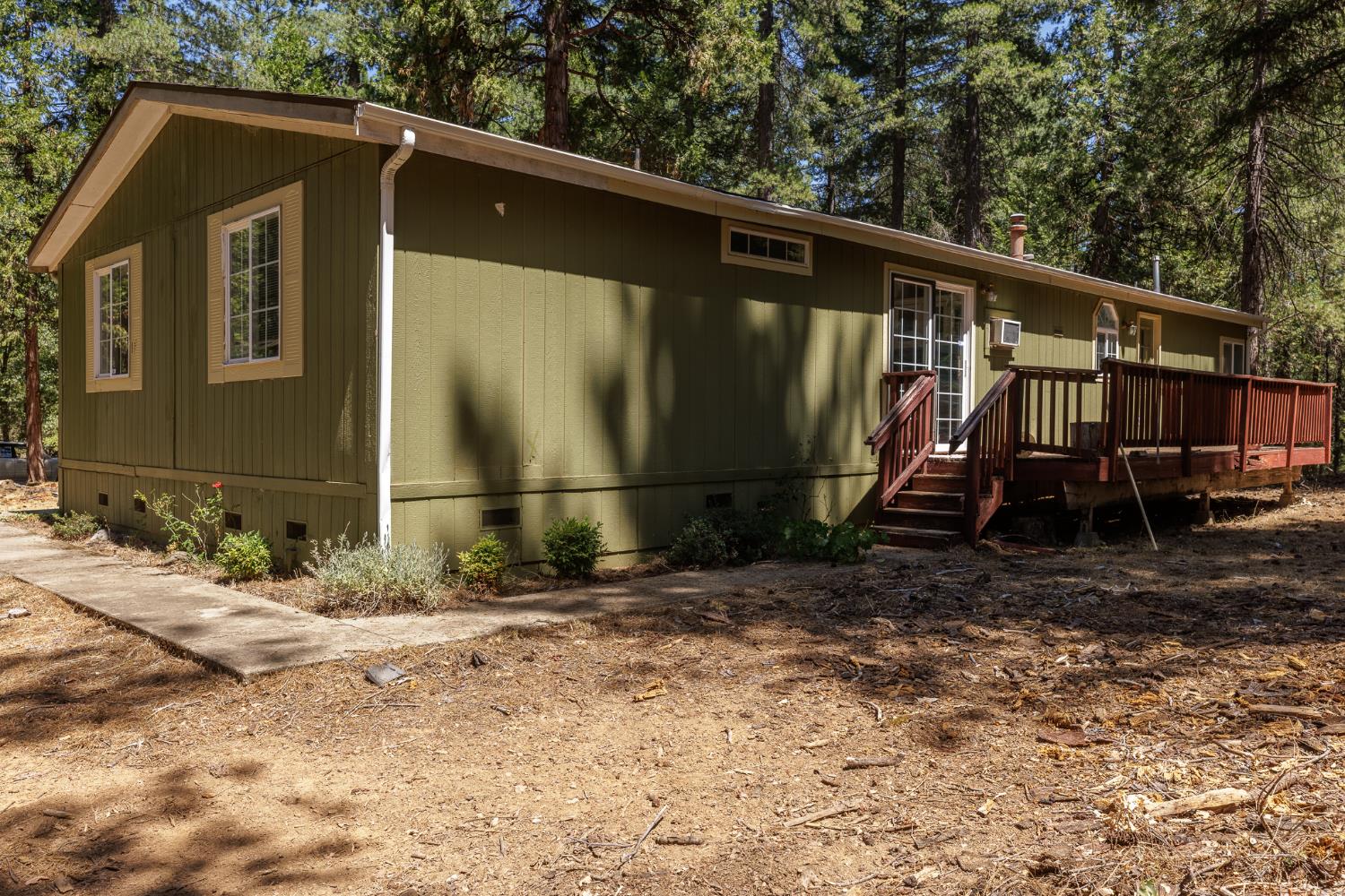 7140 Darling Cabin Road Garden Valley, CA 95633 - Photo 6 of 34 a view of a house with a backyard
