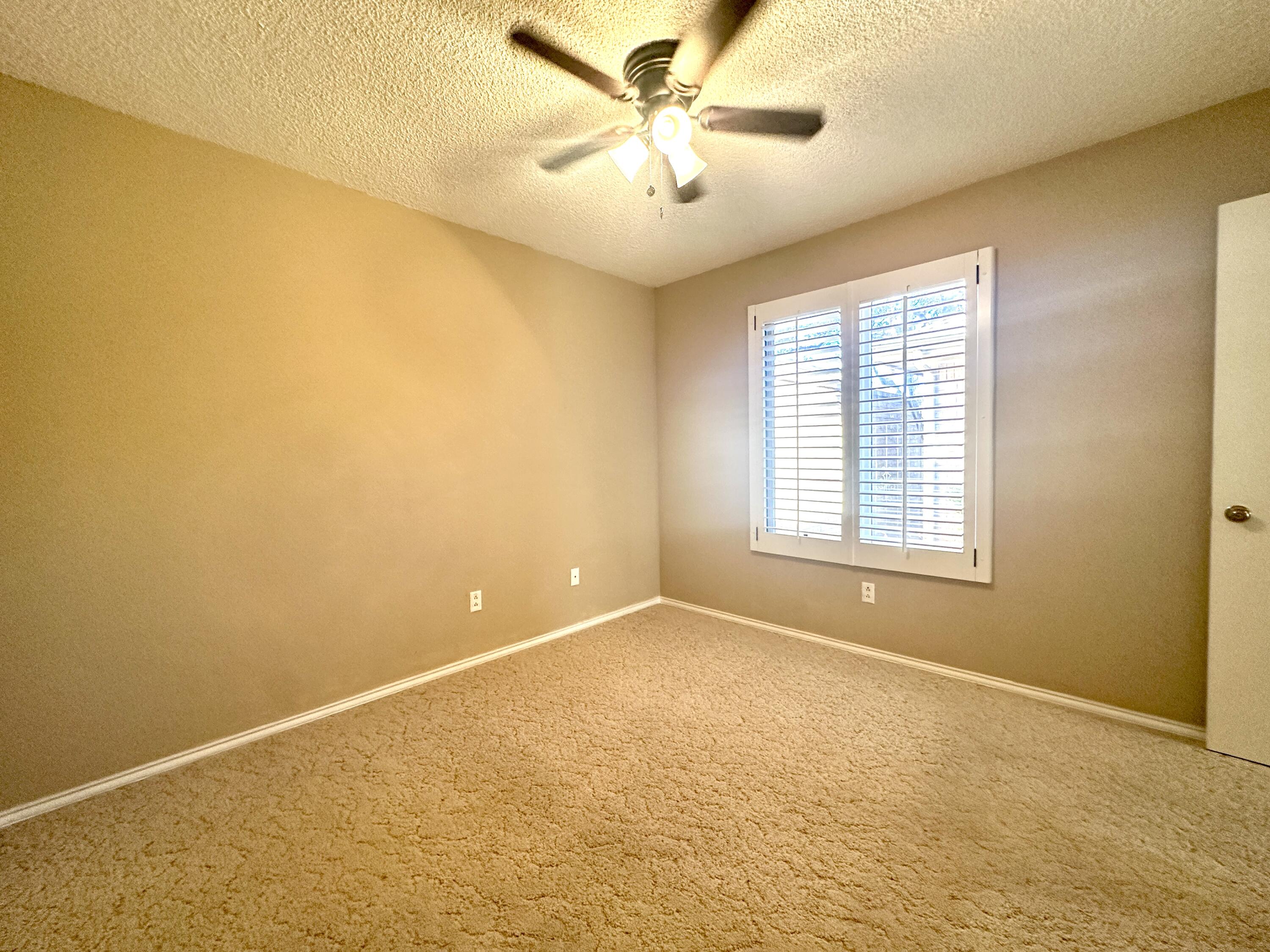 8614 Memphis Avenue, Unit B Lubbock, TX 79423 - Photo 2 of 11 a view of an empty room with a window