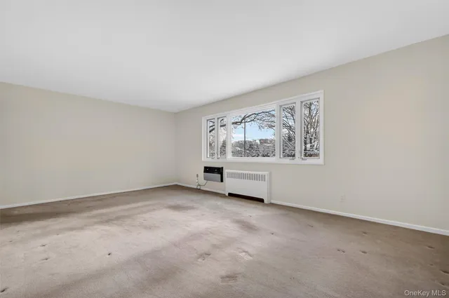 a room with gym equipment and a window