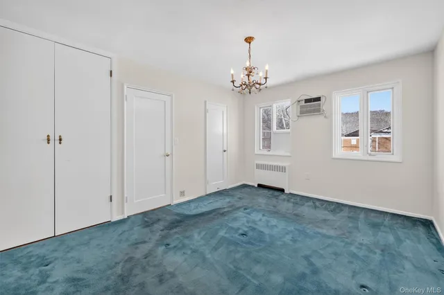 a view of an empty room with a bathroom