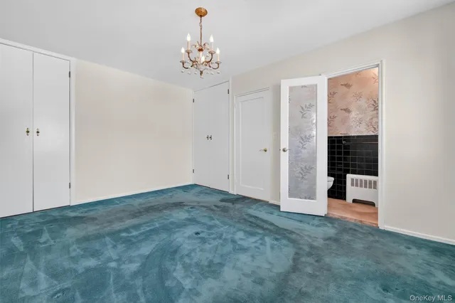 a bathroom with a granite countertop sink a mirror and vanity