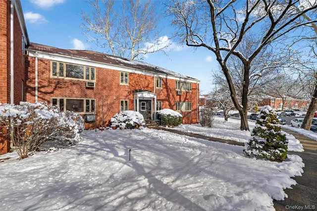 a view of a building with a large tree