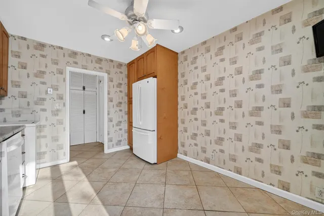 a view of a bedroom with furniture and cabinets