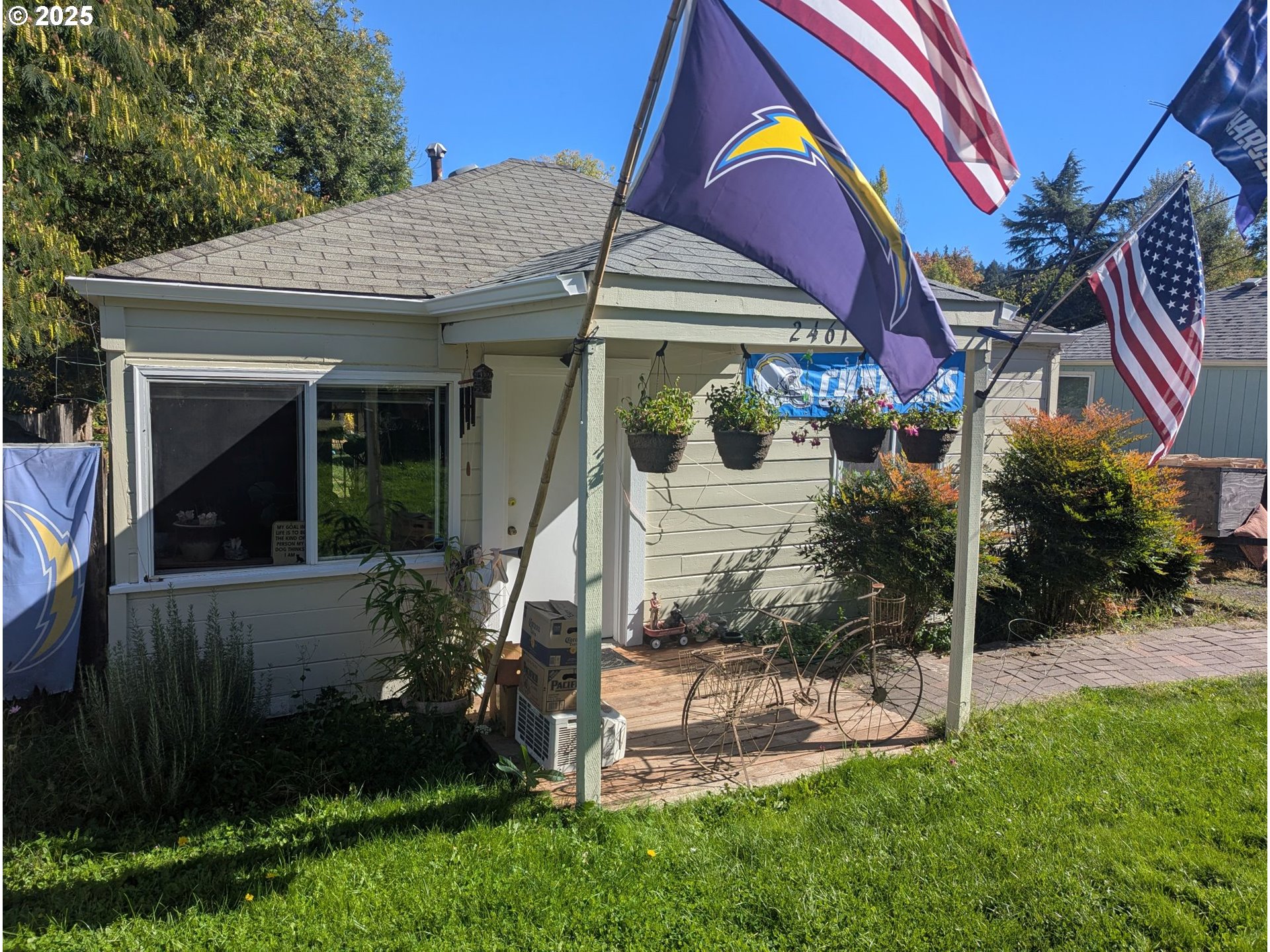 2461 Riverview Street Eugene, OR 97403 - Photo 2 of 8 a view of a house with a yard