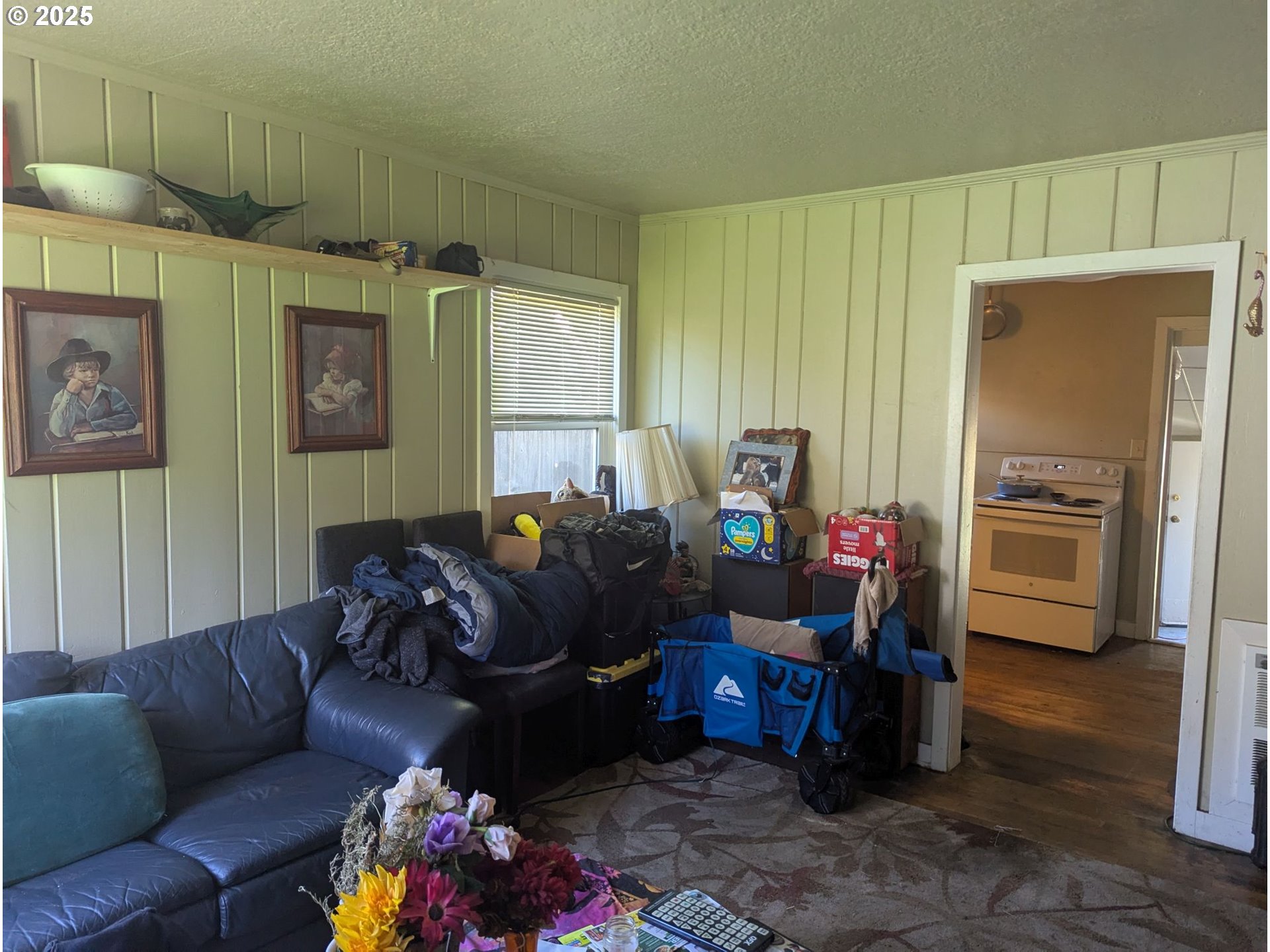 2461 Riverview Street Eugene, OR 97403 - Photo 3 of 8 a living room with furniture fireplace and a window