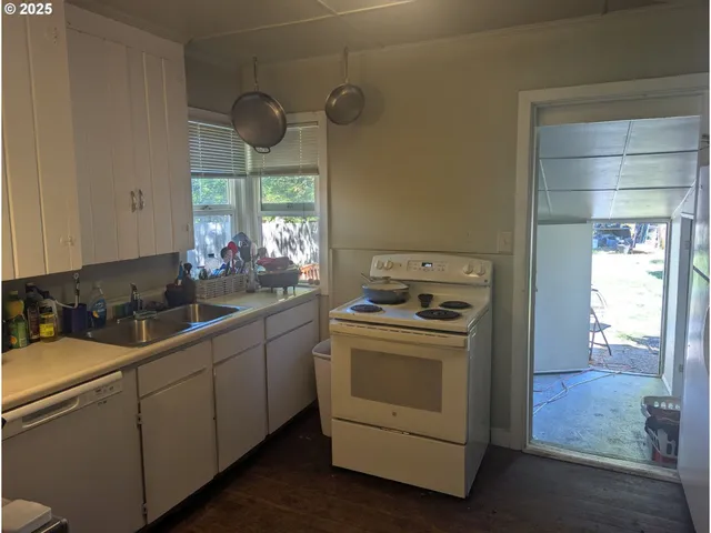 a kitchen with a stove and a sink