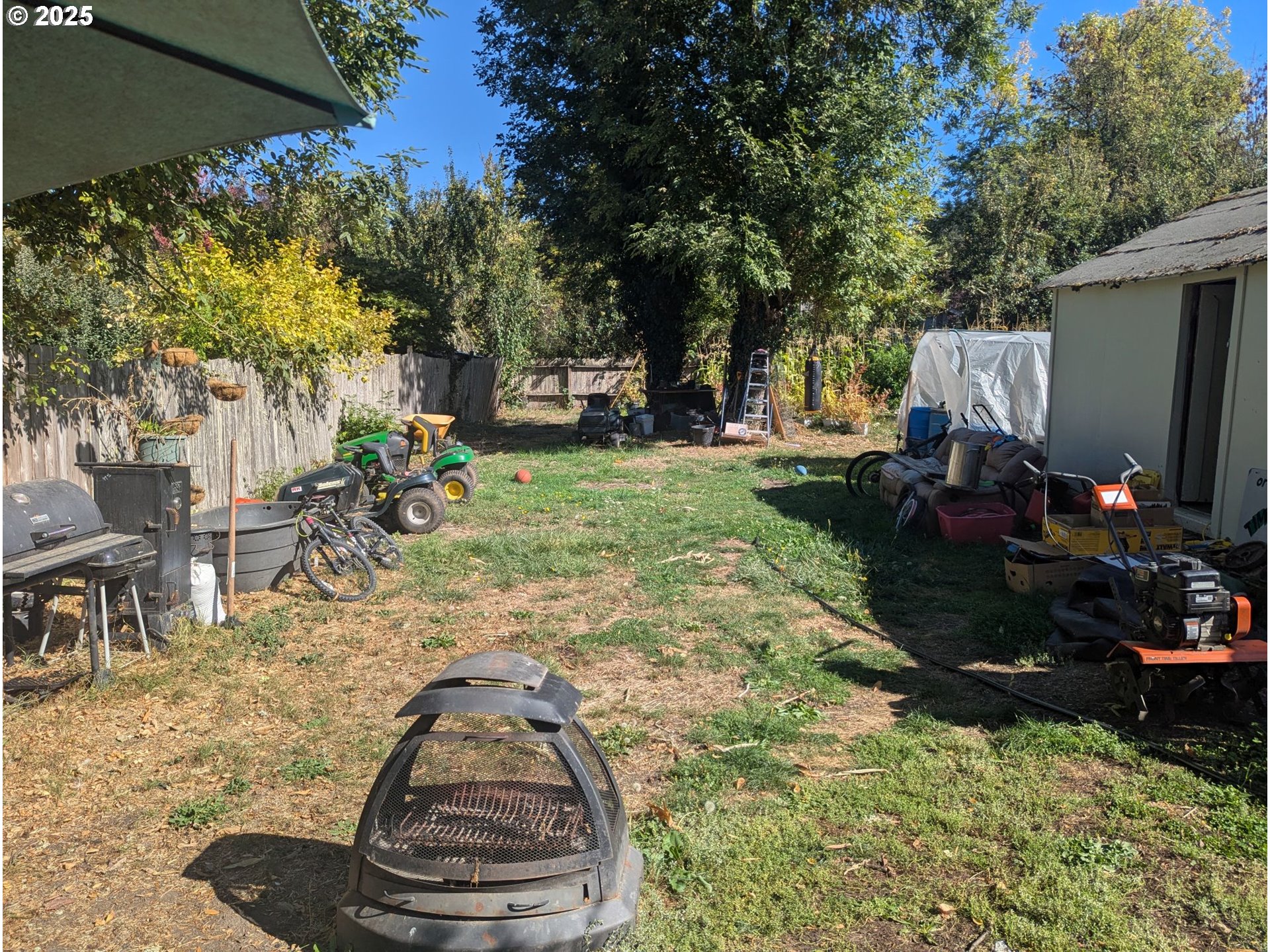2461 Riverview Street Eugene, OR 97403 - Photo 6 of 8 a view of a backyard with sitting area