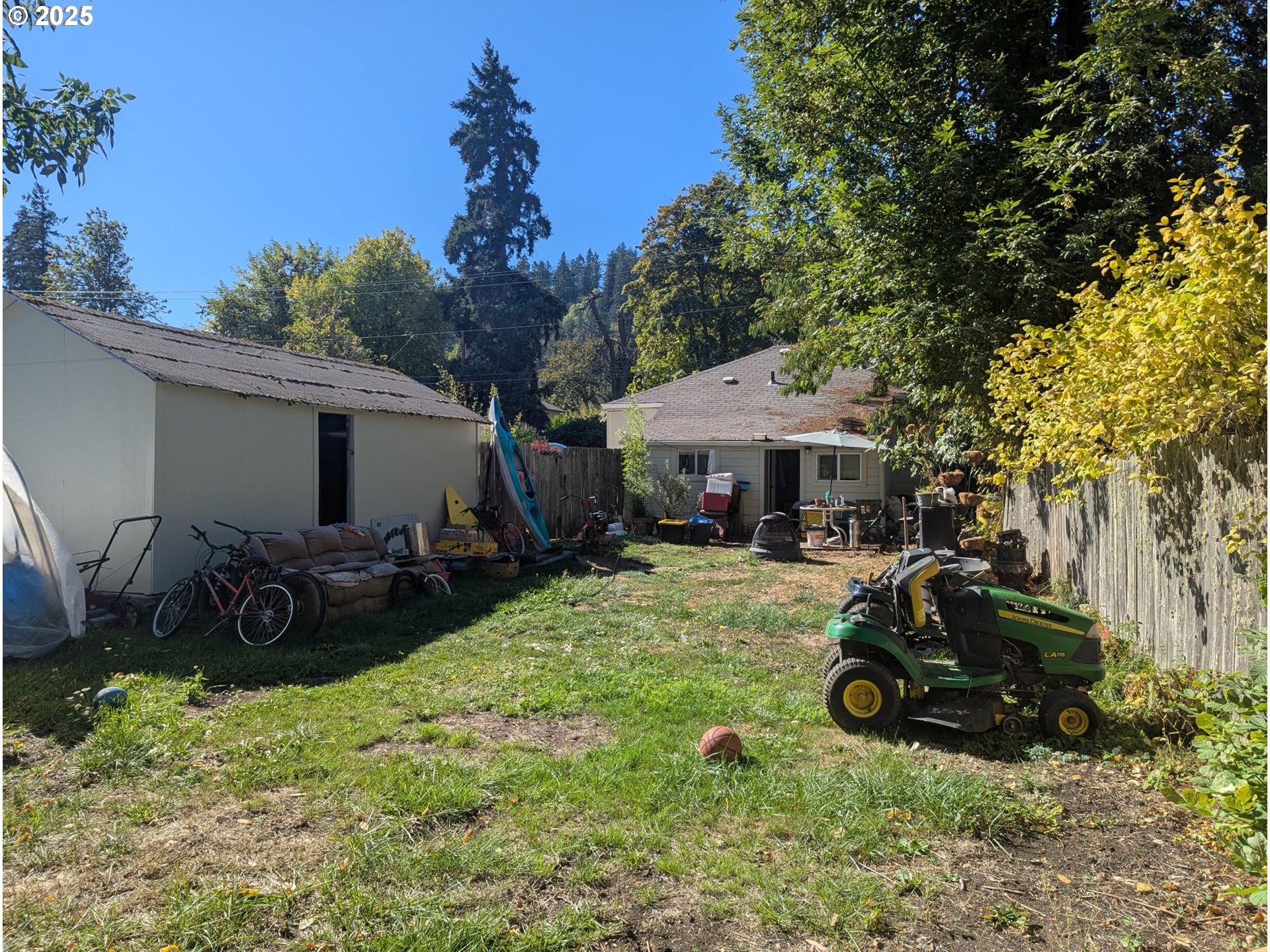 2461 Riverview Street Eugene, OR 97403 - Photo 7 of 8 a view of a house with backyard and sitting area