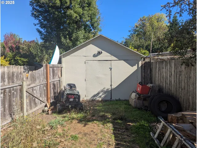 a view of a barn in the yard