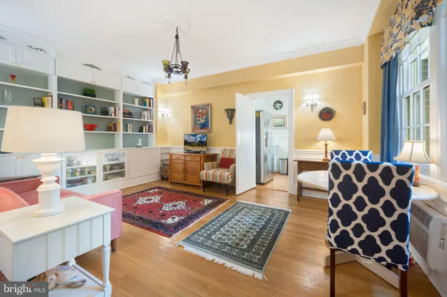 a living room with furniture and a rug