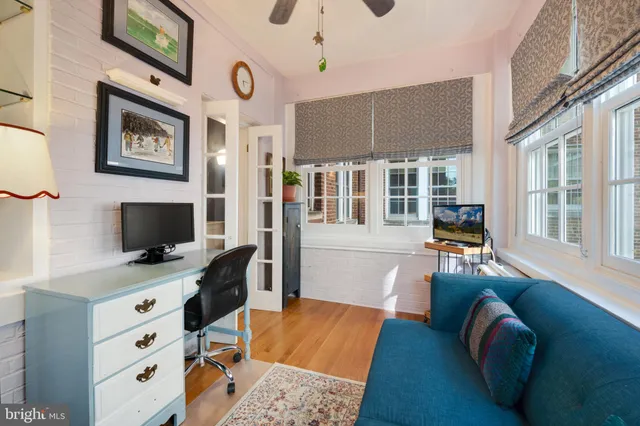 a bathroom with a glass shower door and a mirror