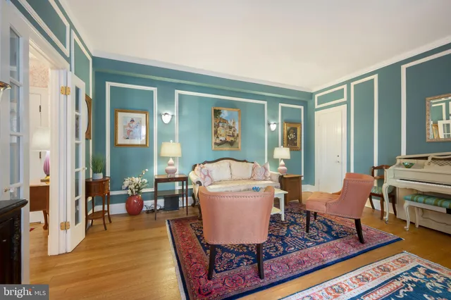 a living room with furniture rug and window