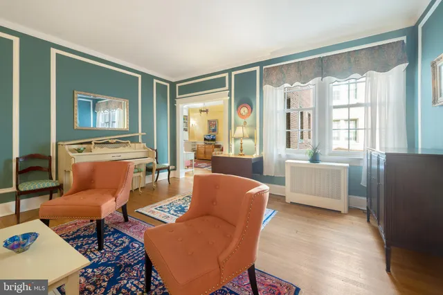 a kitchen with stainless steel appliances white cabinets and a stove top oven