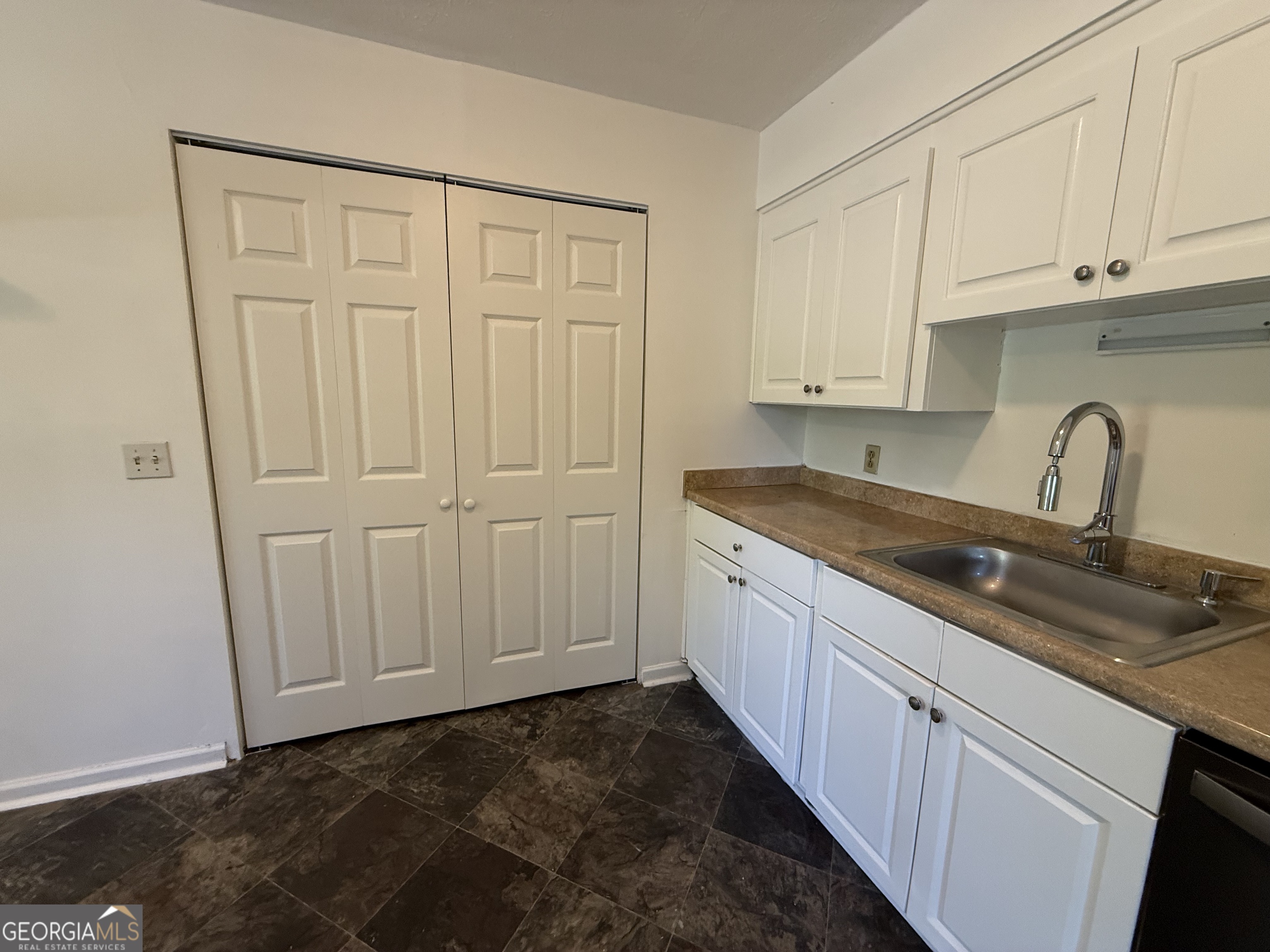 179 Youngs Mill Road LaGrange, GA 30241 - Photo 14 of 30 a kitchen with a sink and cabinets