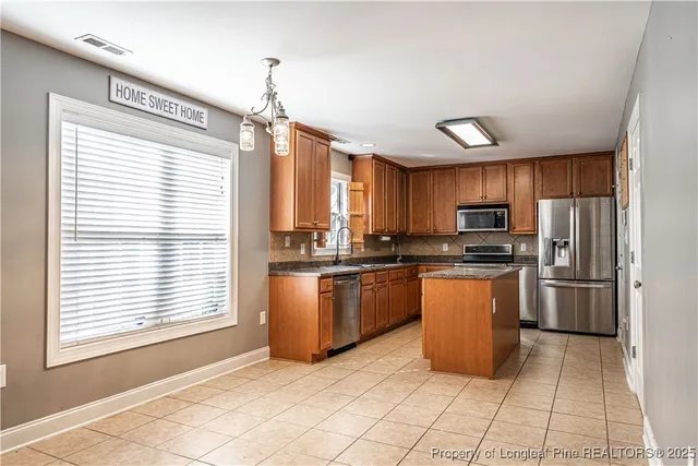 a bathroom with a sink mirror and toilet