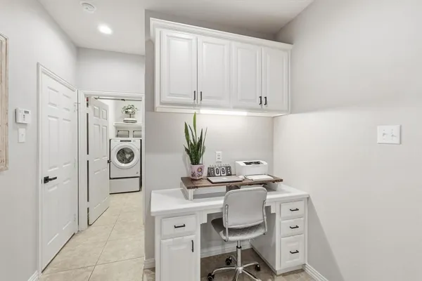 a room with a cabinets and appliances