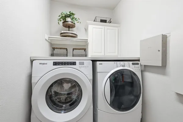 a view of livingroom with washer and dryer