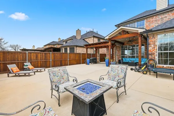 a view of a patio with couches table and chairs
