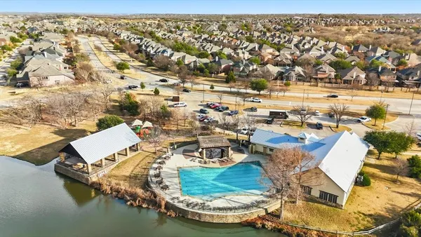 an aerial view of a house with a ocean view
