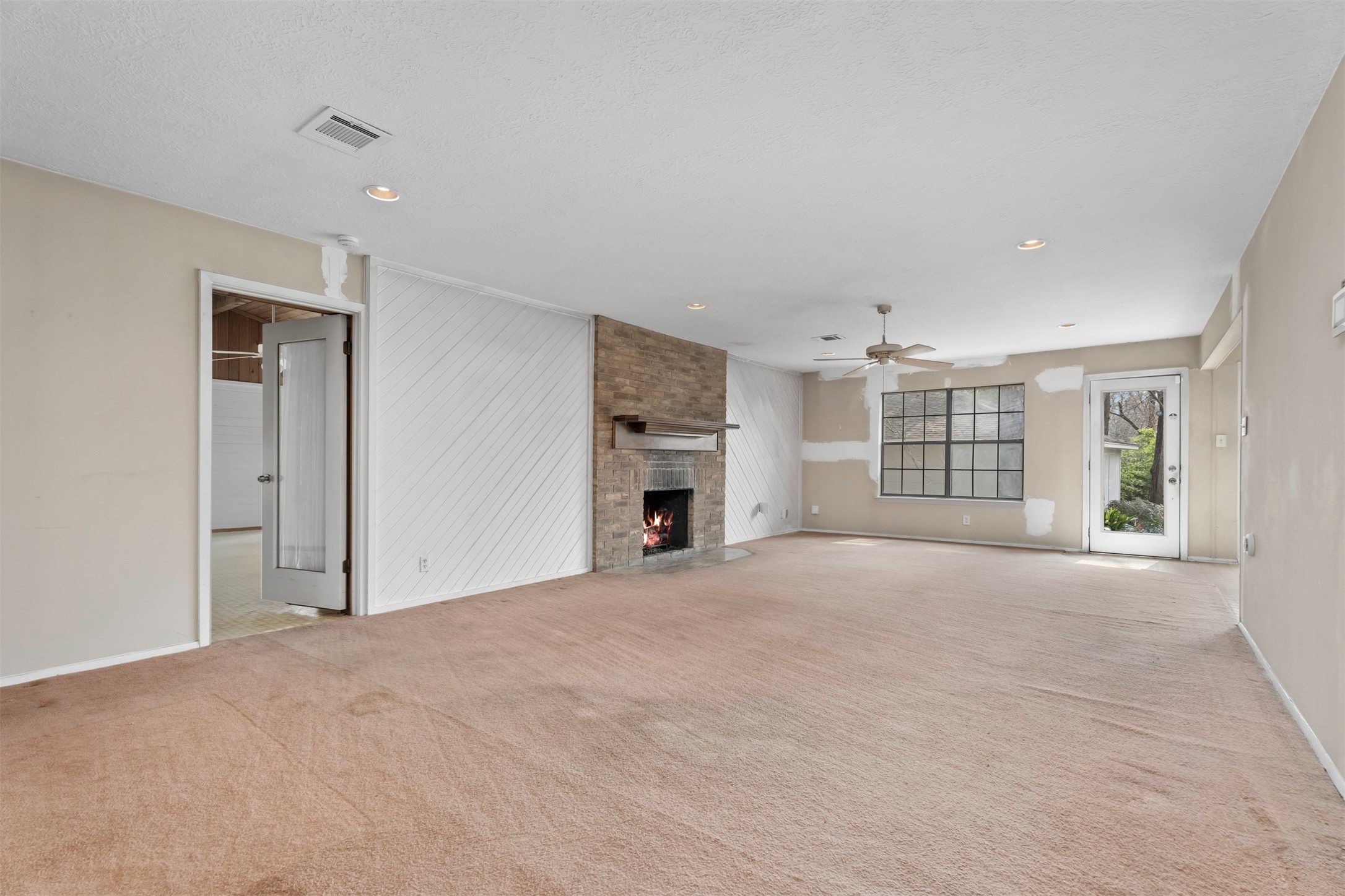 2322 Shadow Glen Lane Spring, TX 77386 - Photo 8 of 48 Spacious living-room with a fire place connecting the space.