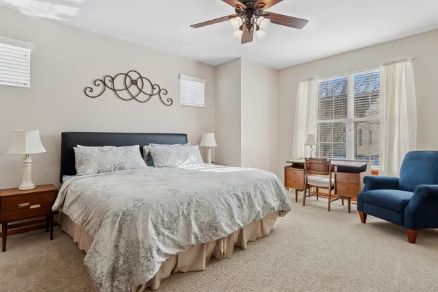 a bedroom with a bed and a couch