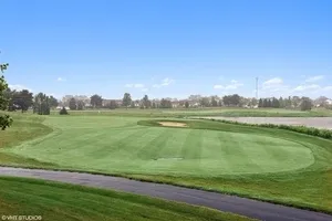 a view of a lake with a big yard