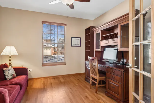 a work room with furniture and wooden floor