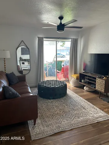 a living room with furniture and a large window