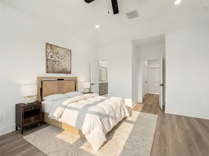 a bedroom with a bed and a couch