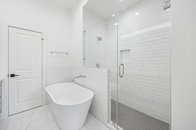 a bathroom with a toilet a sink and shower