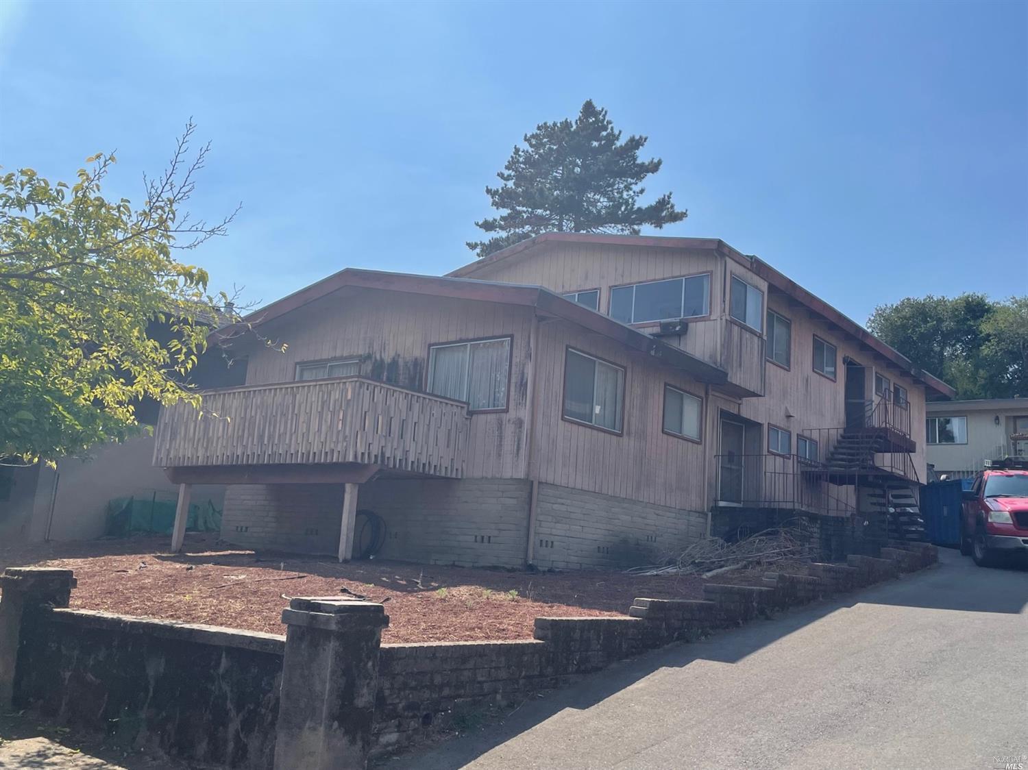 145-147 Clark Street San Rafael, CA 94901 - Photo 1 of 1 a roof deck with table and chairs