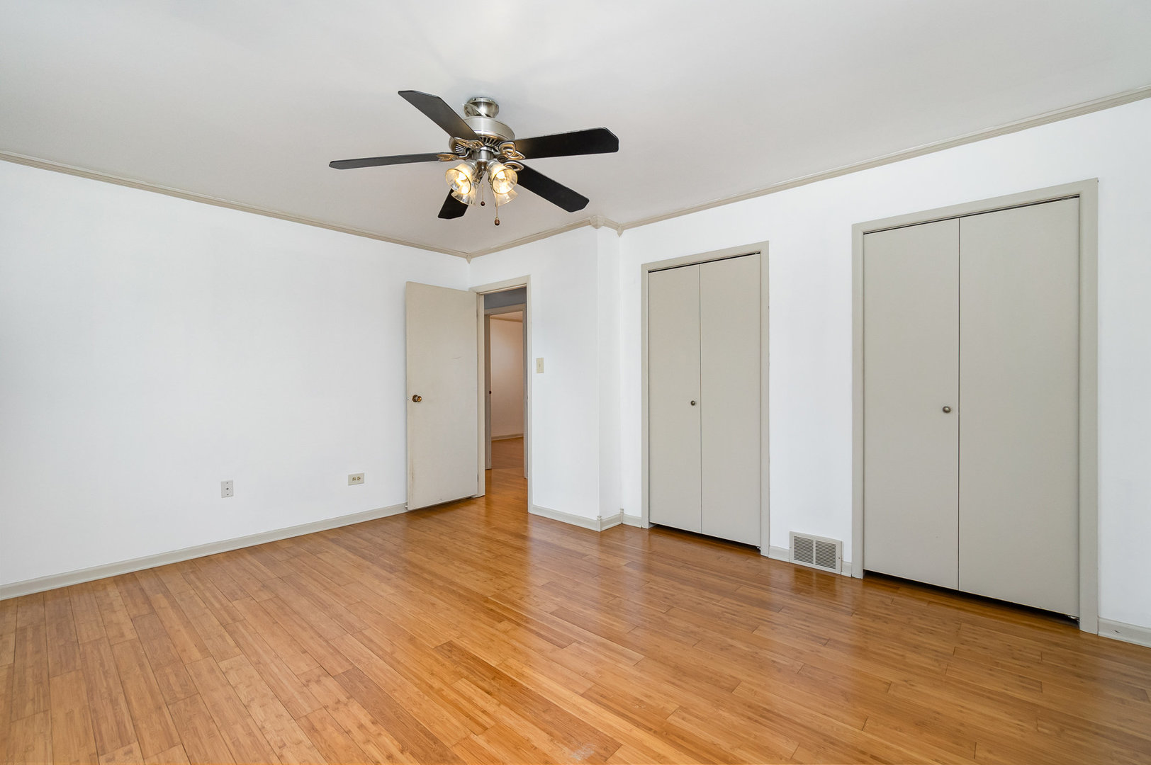 2831 193rd Street Lansing, IL 60438 - Photo 11 of 28 a view of an empty room with wooden floor