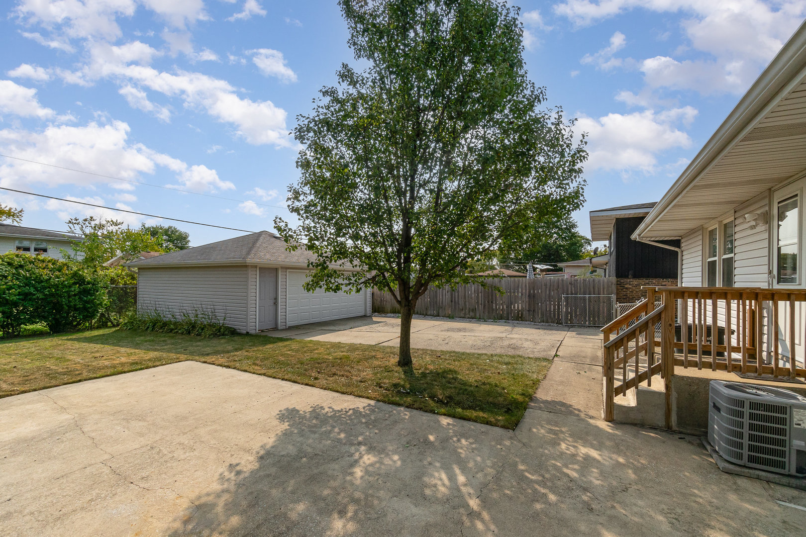2831 193rd Street Lansing, IL 60438 - Photo 22 of 28 a view of a house with backyard and trees