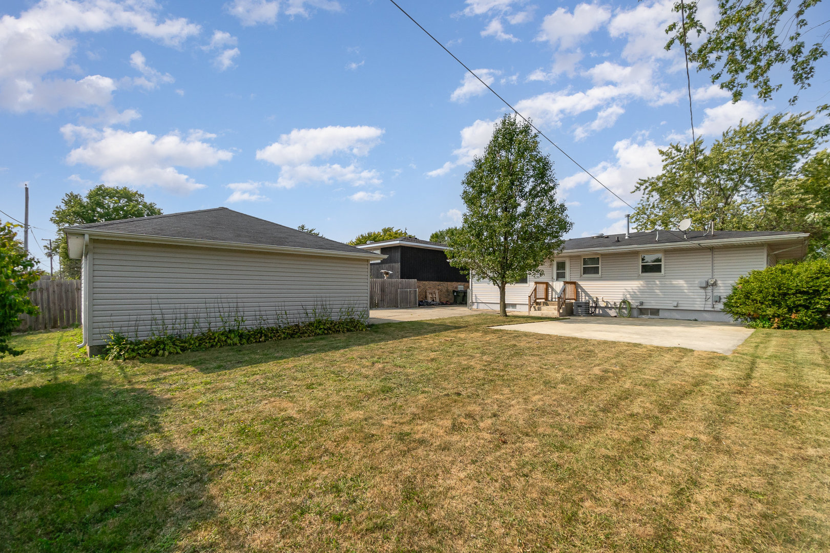 2831 193rd Street Lansing, IL 60438 - Photo 24 of 28 a view of house with backyard and trees