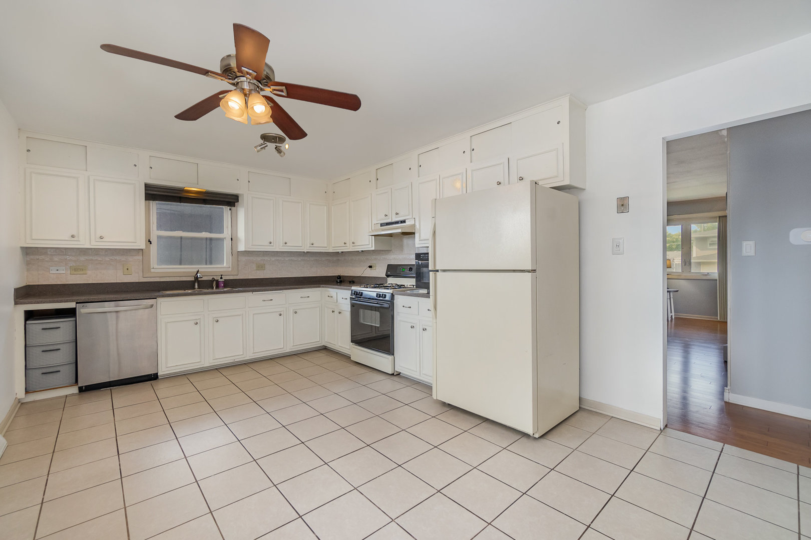 2831 193rd Street Lansing, IL 60438 - Photo 9 of 28 a kitchen with a refrigerator a sink and dishwasher