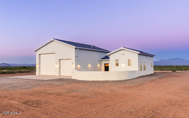 6233 West Airport Road Willcox, AZ 85643 - Photo 1 of 54 a view of a house with a backyard