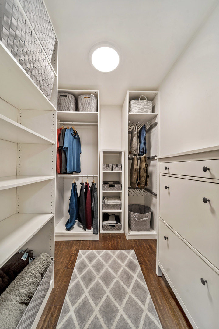 28W140 Mack Road Wheaton, IL 60189 - Photo 23 of 48 a view of walk in closet with clothes and shoes